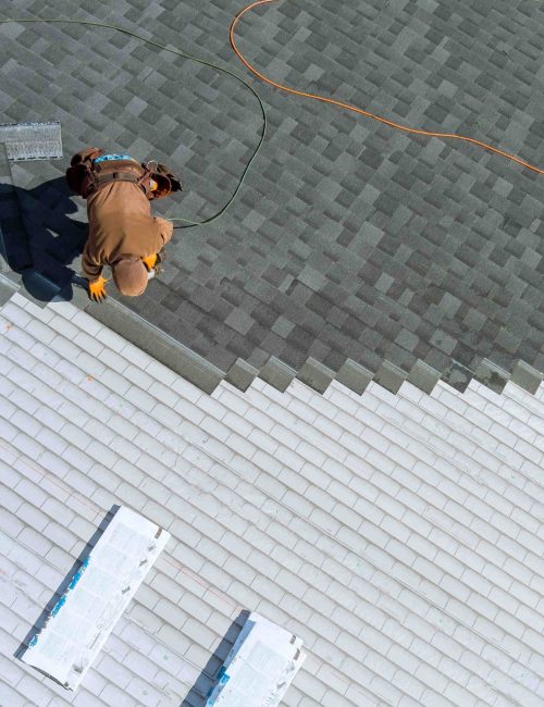 a-worker-installing-shingles-on-the-roof-of-a-home-2025-03-27-03-42-13-utc_11zon